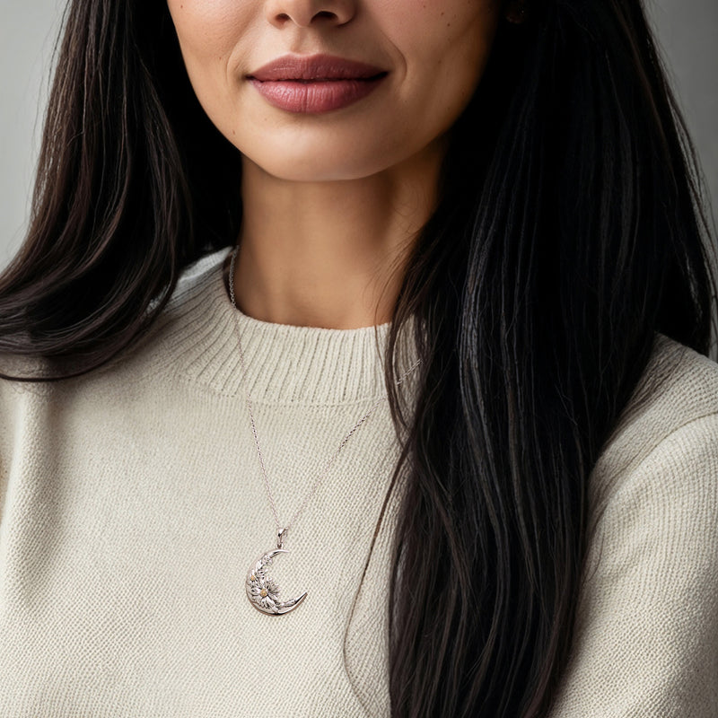 Moon pendant necklace worn at collar, sterling silver with yellow-gold flower highlights