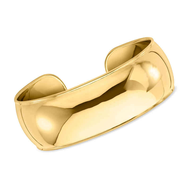 Wide cuff bracelet with smooth gold-tone finish, polished inner band