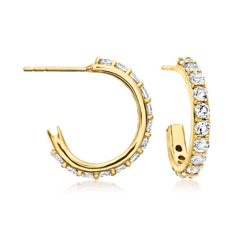 Gold hoop earrings with white topaz stones on inner and outer hoops, hinged post