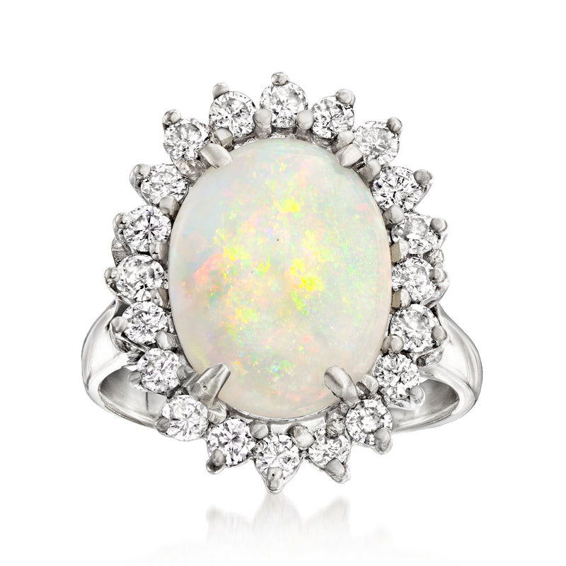 Oval opal cocktail ring with diamond halo in 14kt white gold band
