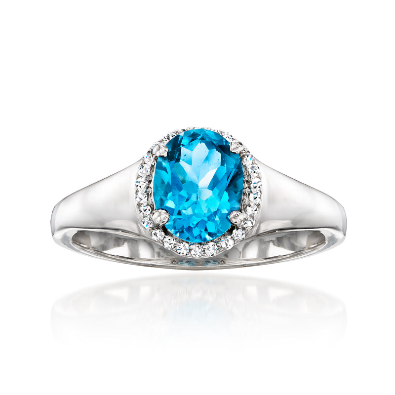 Sterling silver ring with oval London blue topaz and halo of white topaz stones