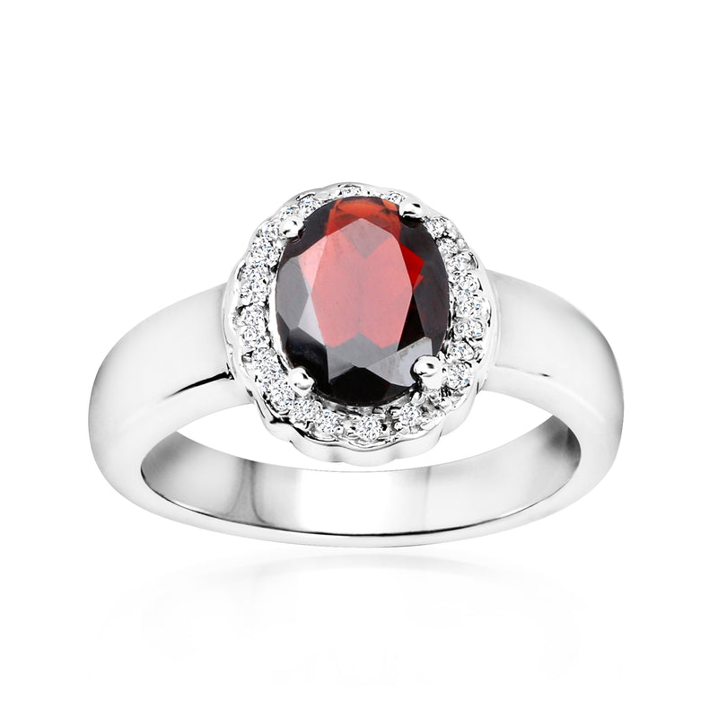 Sterling silver garnet ring with halo of white stones and oval red center