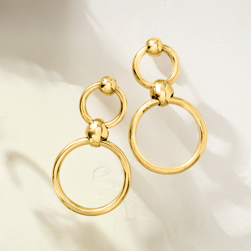 Gold-tone double open-circle drop earrings with two dangling ring loops