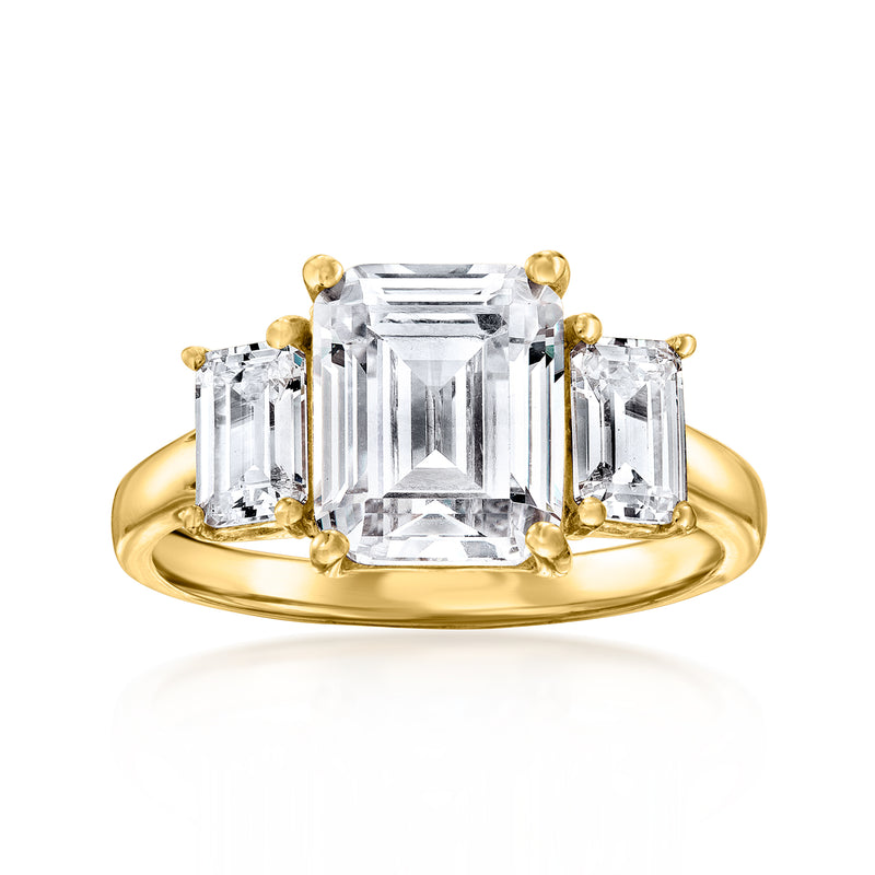 Three-stone CZ ring in gold over sterling with a large emerald-cut center stone