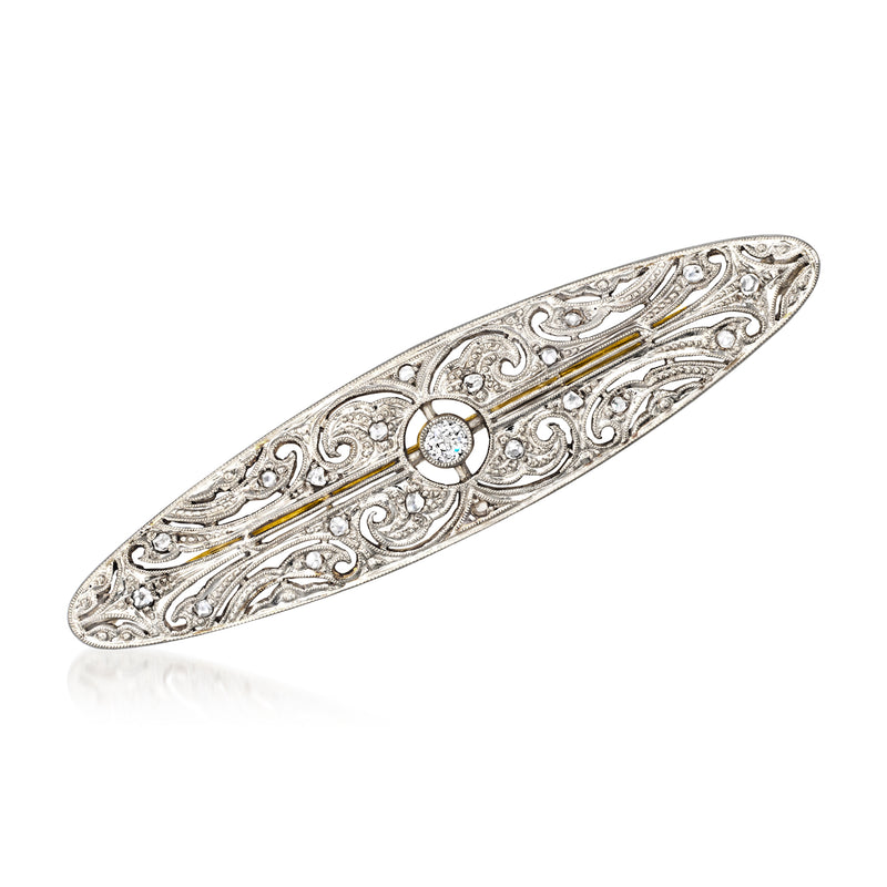 Vintage diamond filigree pin with round center stone, platinum with yellow-gold accents