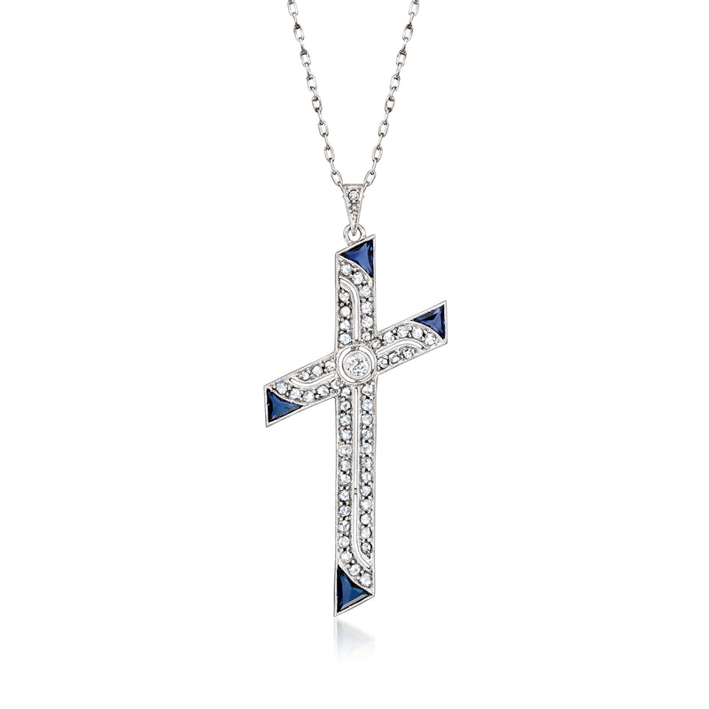 Cross pendant necklace in white gold with blue sapphire accents and diamond-like stones