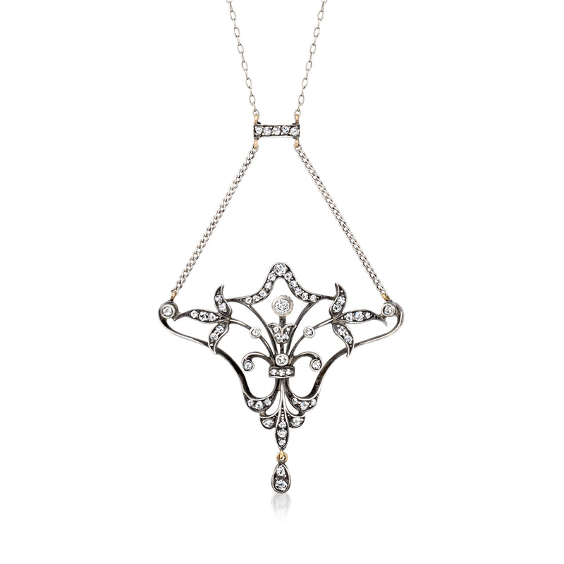 Diamond drop necklace with ornate marquise pendant in sterling silver and gold on chain