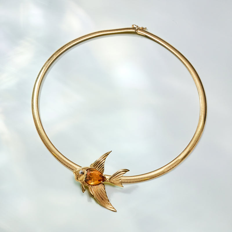 14kt yellow gold fish slide necklace with orange gemstone and fin details