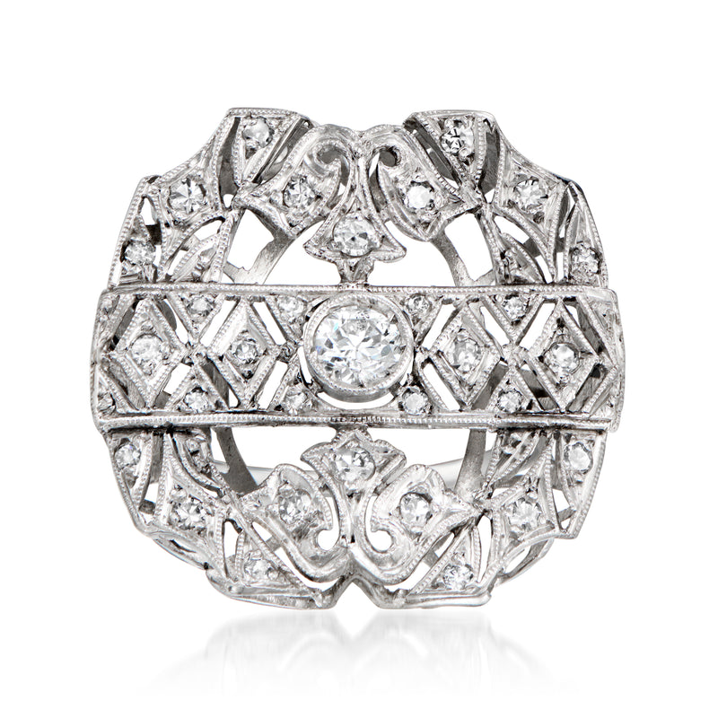 Vintage diamond filigree ring in platinum with round center stone, ornate geometric setting