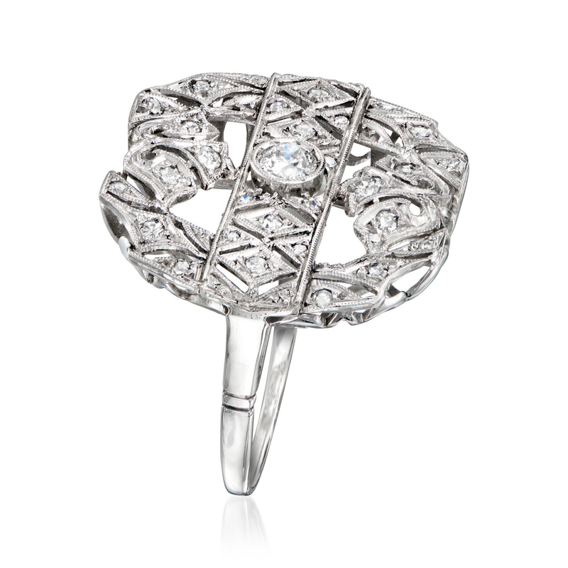 Platinum diamond filigree ring with round stone, side view showing openwork bands