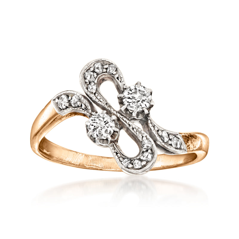 Vintage diamond swirl ring in 18kt yellow gold with two round stones