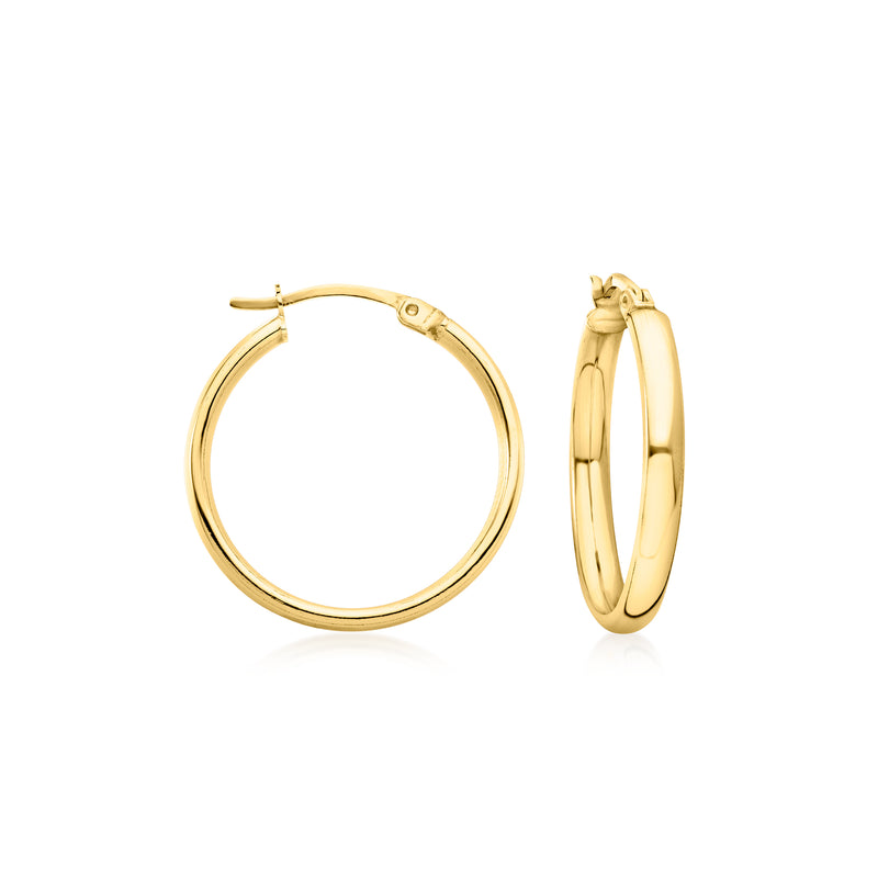 Gold flat hoop earrings with smooth round profile and hinge clasp