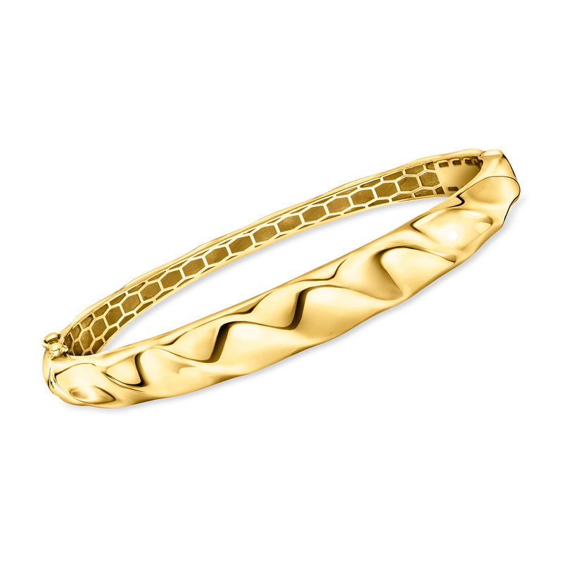 Gold-tone wavy bangle bracelet with textured snake-like pattern and open ends