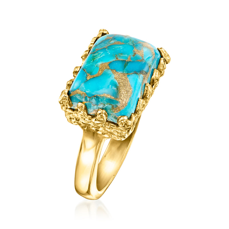 Gold-tone ring with large rectangular turquoise gemstone, angled view