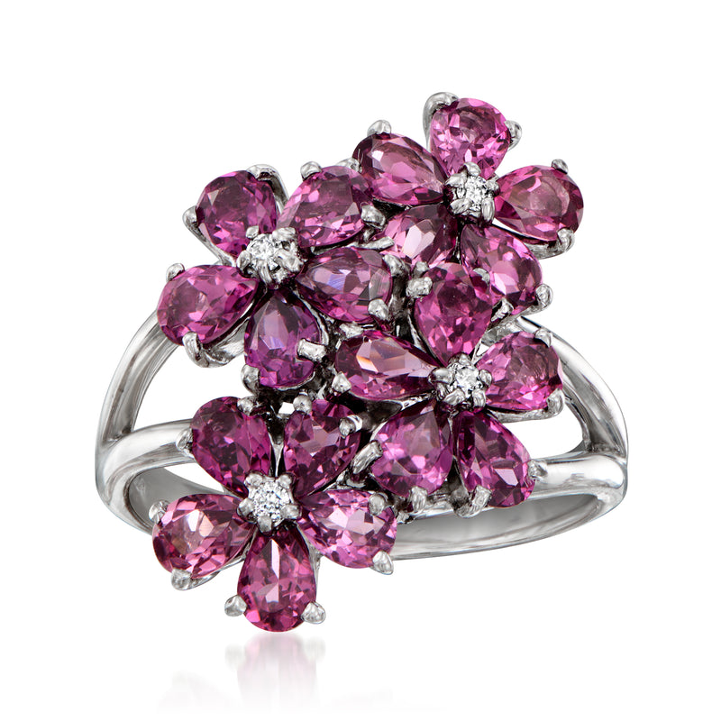 White gold flower-cluster ring with pink rhodolite garnets and small diamond accents