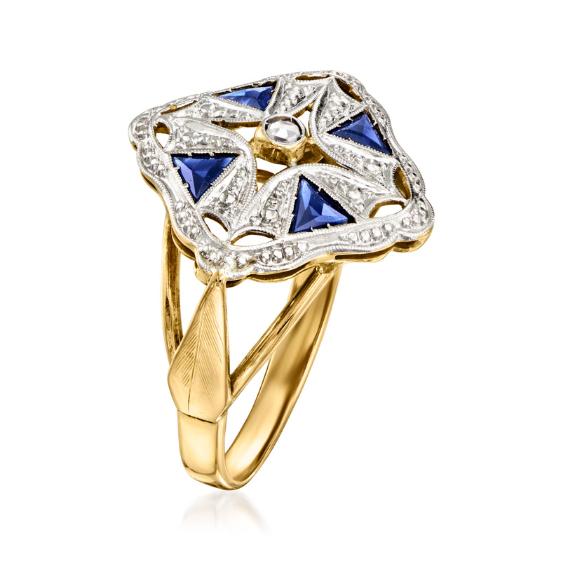 Art-deco sapphire ring with blue triangular settings and halo center stone, yellow gold band