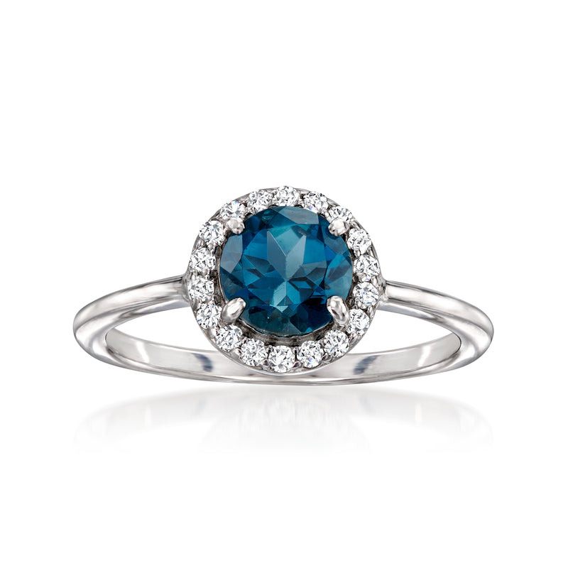 Sterling silver ring with oval London blue gemstone surrounded by white topaz accents