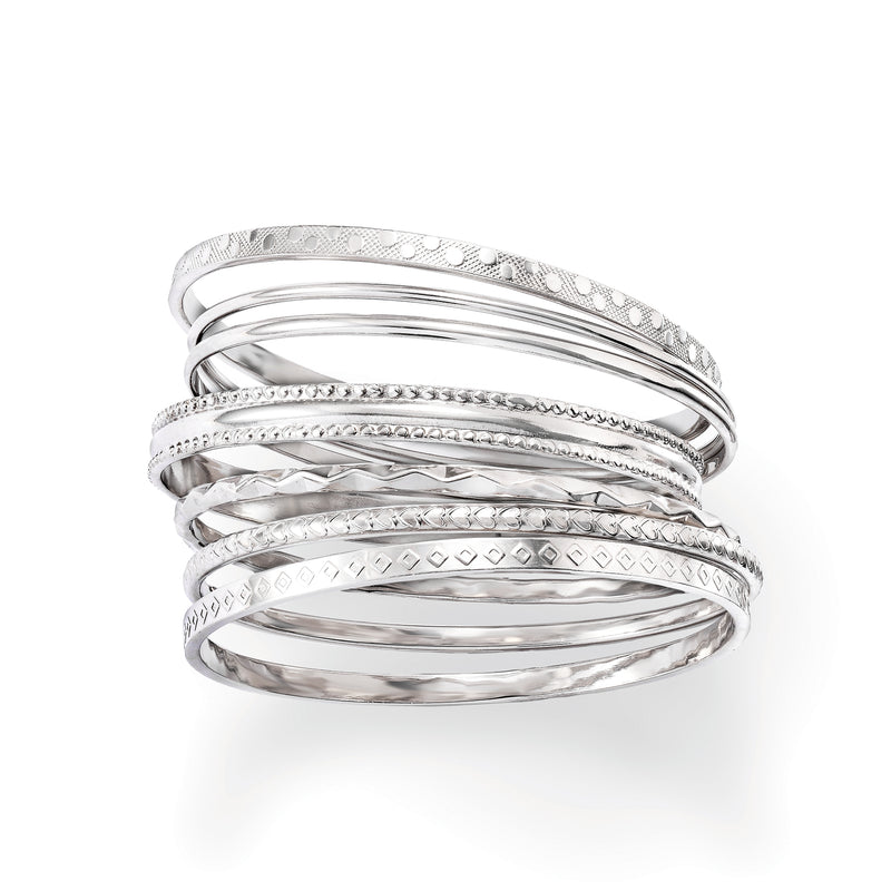Assorted sterling silver textured bangles with swirling and diamond patterns, stacked