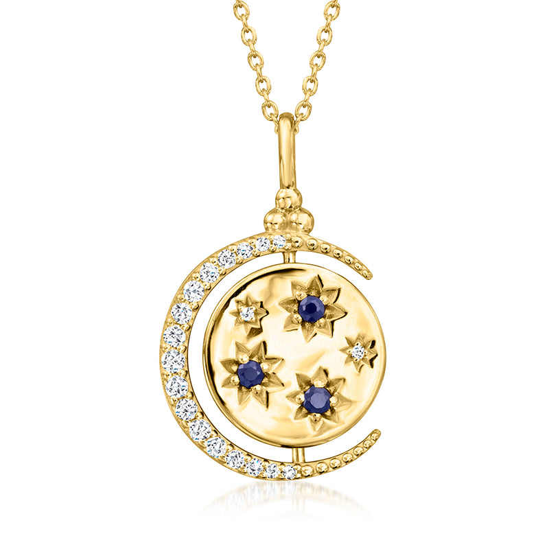Gold reversible celestial pendant necklace with moon design, blue sapphires and white stones