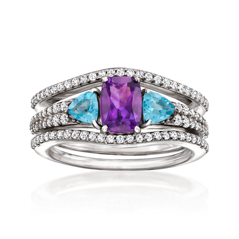 Sterling silver ring set with amethyst center, blue topaz accents, and white diamond-like stones