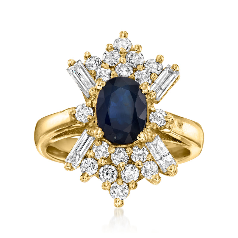 Vintage sapphire and diamond ring with oval dark blue center, 14k yellow gold halo