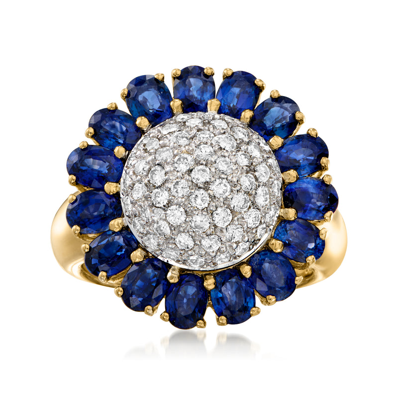 18kt yellow gold flower ring with deep blue sapphires and round diamond halo