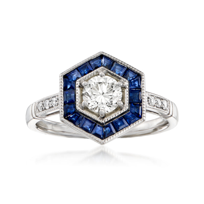 Platinum geometric vintage ring with round diamond center and blue sapphire accents