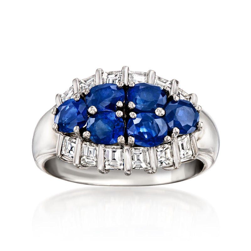 Platinum sapphire and diamond cluster ring with oval blue center stone and baguette sides