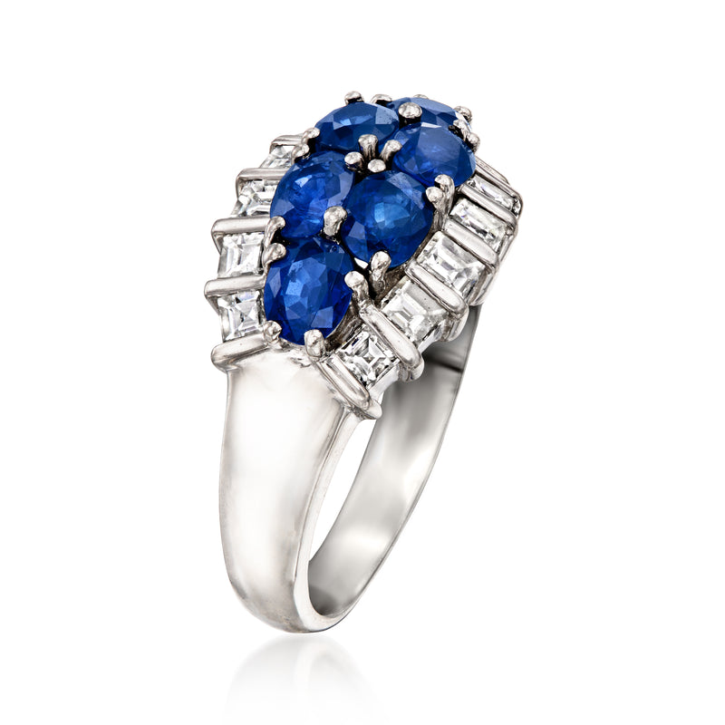 Platinum ring with large oval blue sapphire center and baguette diamond side clusters
