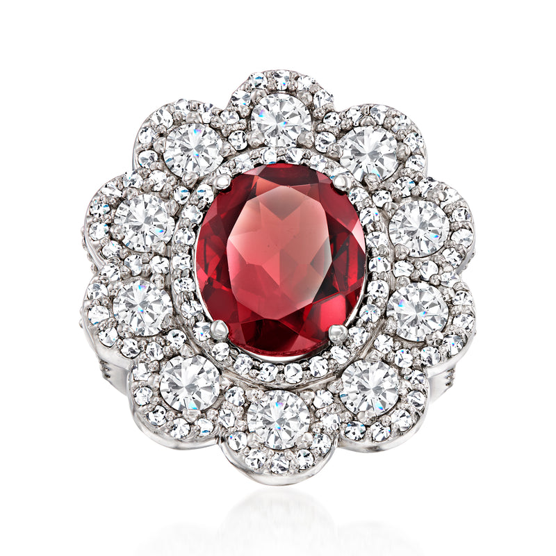 Vintage flower ring in 14kt white gold with red garnet center and diamond halo