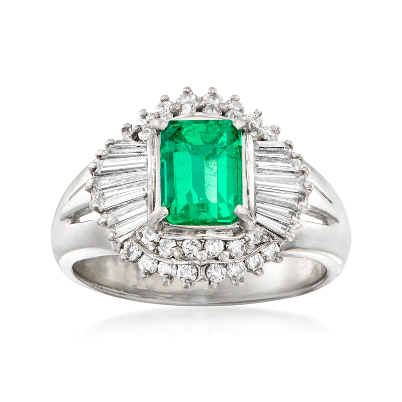 Platinum ring with emerald-cut green center and diamond halo, baguette side stones