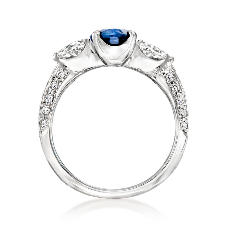 Vintage platinum ring with oval blue sapphire and diamond accents