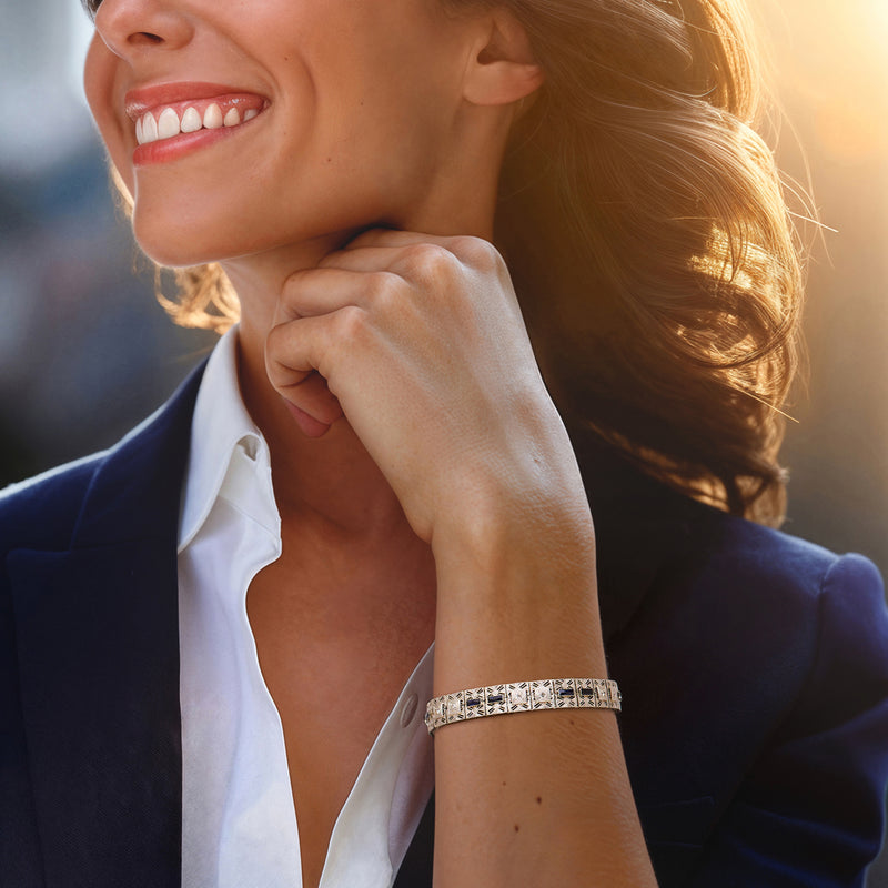 White-metal bracelet with blue square stones and sparkling clear stone row detail on wrist