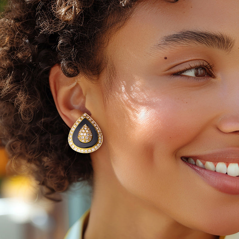 Onyx teardrop earrings with diamond halo on model, 18kt yellow gold