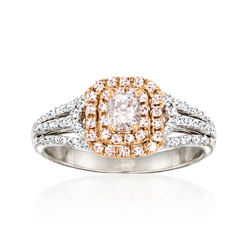 Two-tone gold diamond ring with oval center and pink-and-white halo, split shoulders