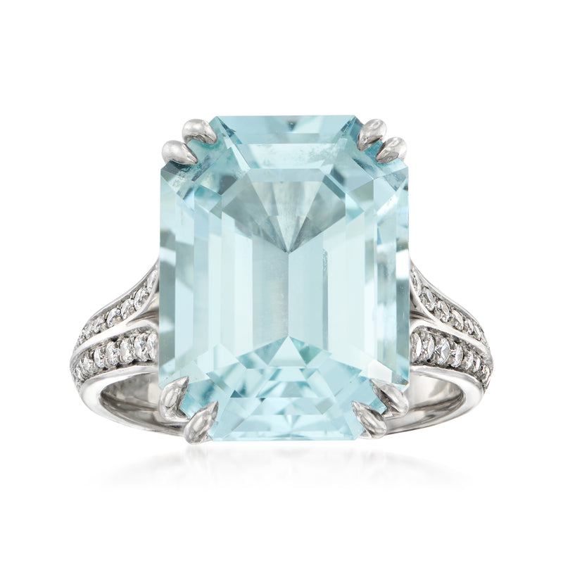 Platinum ring with emerald-cut aquamarine and diamond pave shoulders