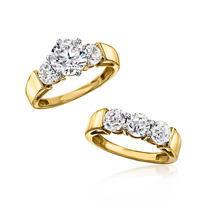Gold-tone CZ two-ring stack with prong-set round clear stones, angled view