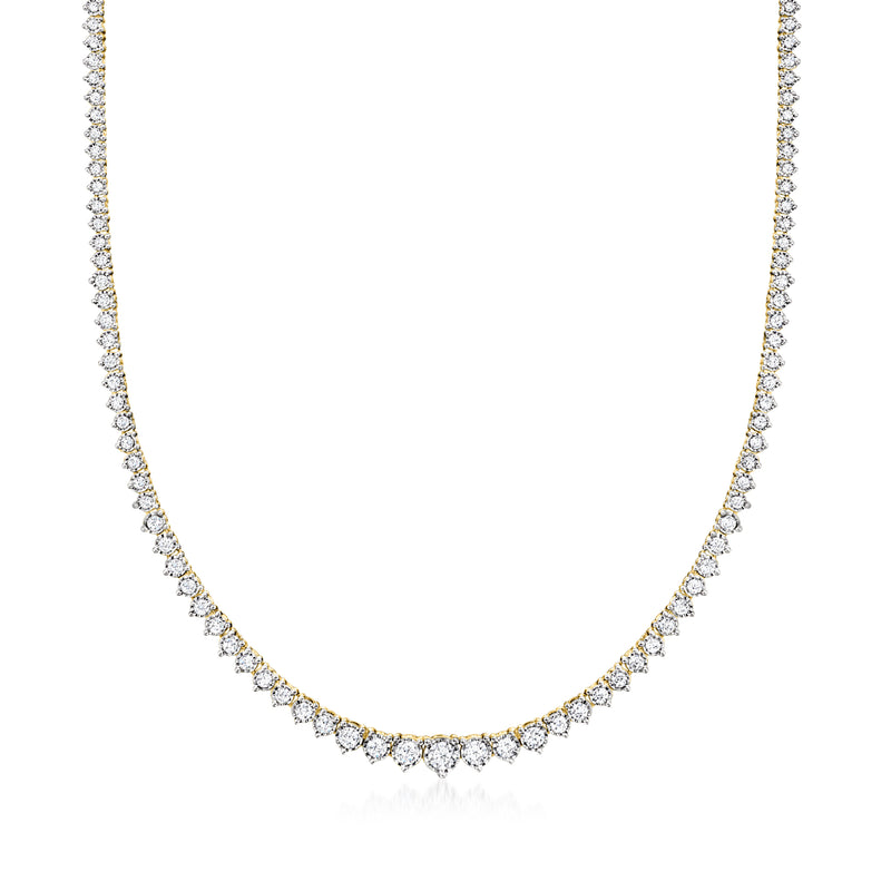 Graduated diamond tennis necklace with gold setting, round stones line the chain.