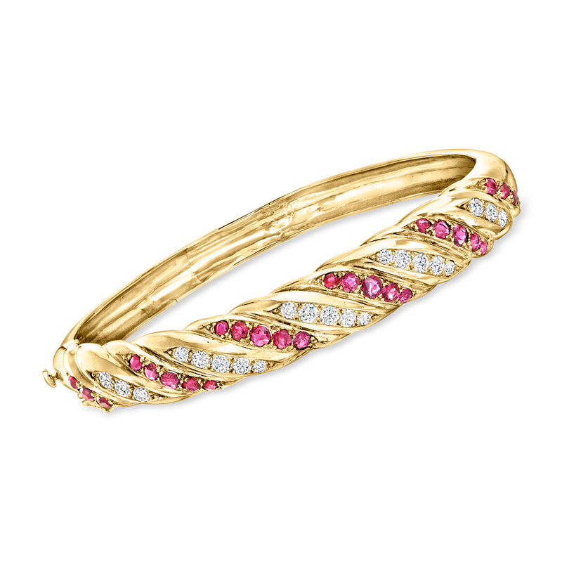 Vintage twisted yellow gold bangle bracelet with pink ruby and diamond accents
