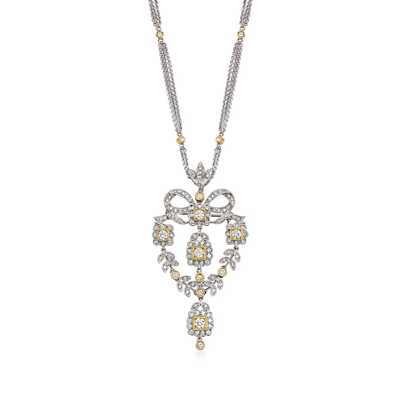 Two-tone gold diamond heart pendant necklace with bow motif and teardrop accents