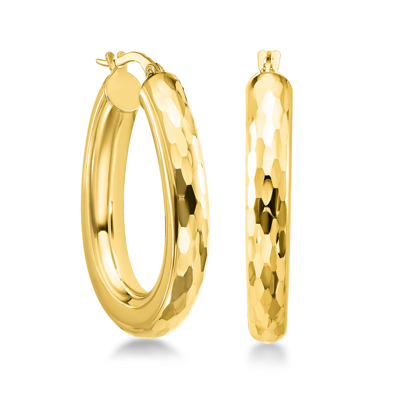 Oval yellow gold hoop earrings with faceted polished surface and hinged closure