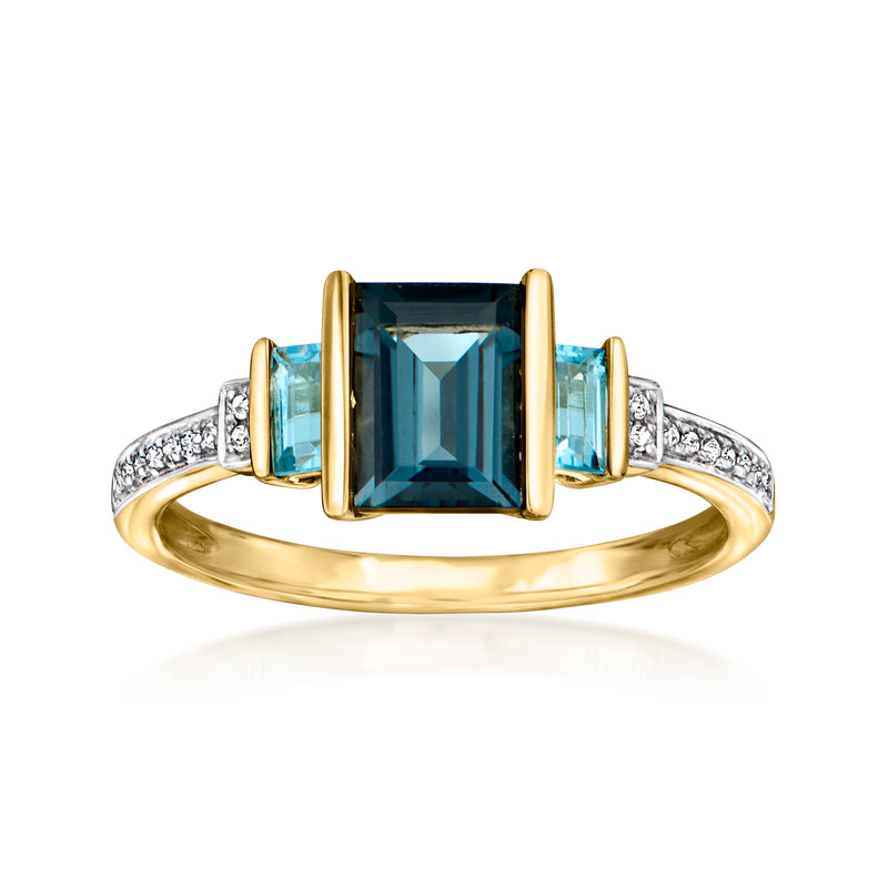 14kt yellow gold ring with blue topaz center, baguette sides, diamond pave band