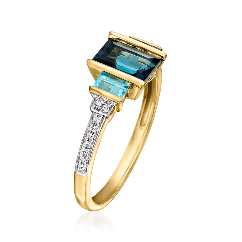 14kt yellow gold ring with blue topaz center, blue baguette stones, diamond accents