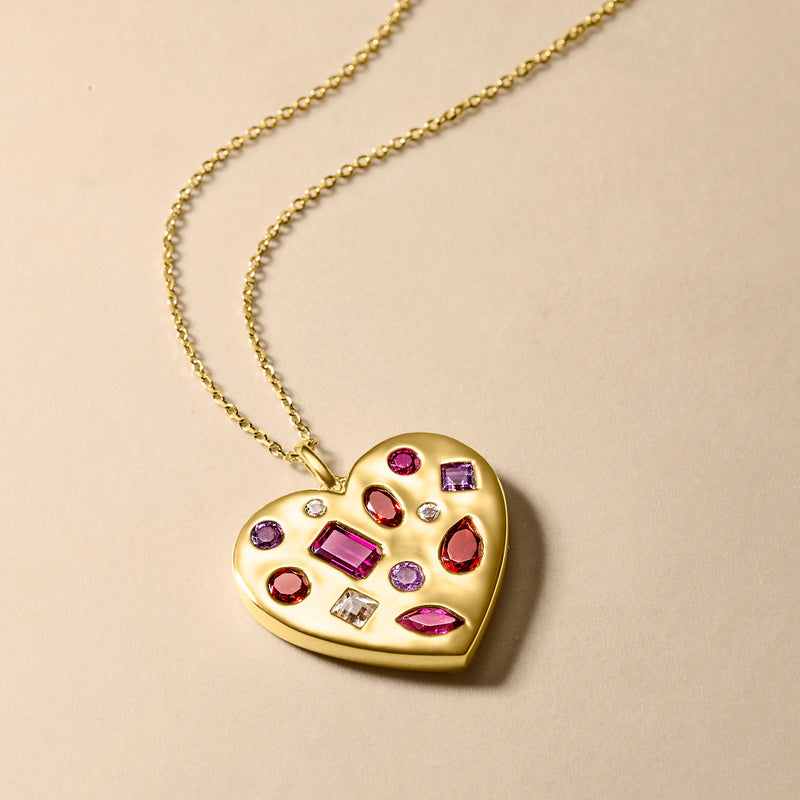 Gold heart pendant necklace with multi-gem stones, shown with chain