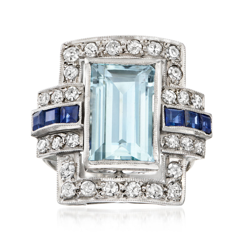 Platinum vintage ring with rectangular aquamarine center, diamonds and sapphire accents.