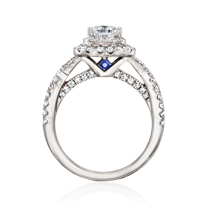 White gold diamond ring with blue sapphire centerpiece in halo prongs
