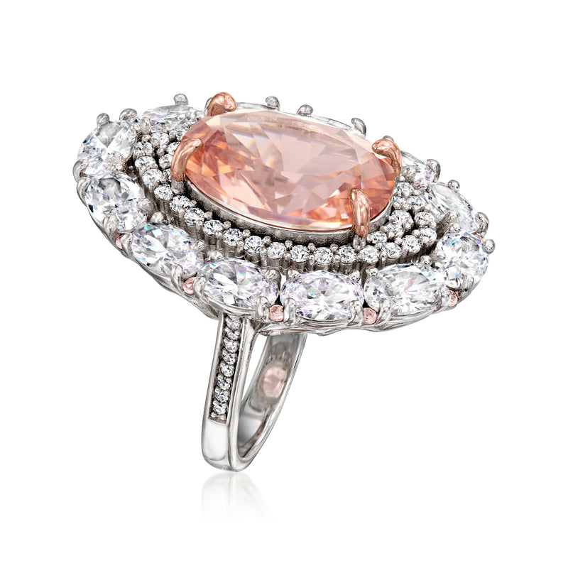 Oval peach center stone ring with clear CZ side stones, rose gold bezel on silver band