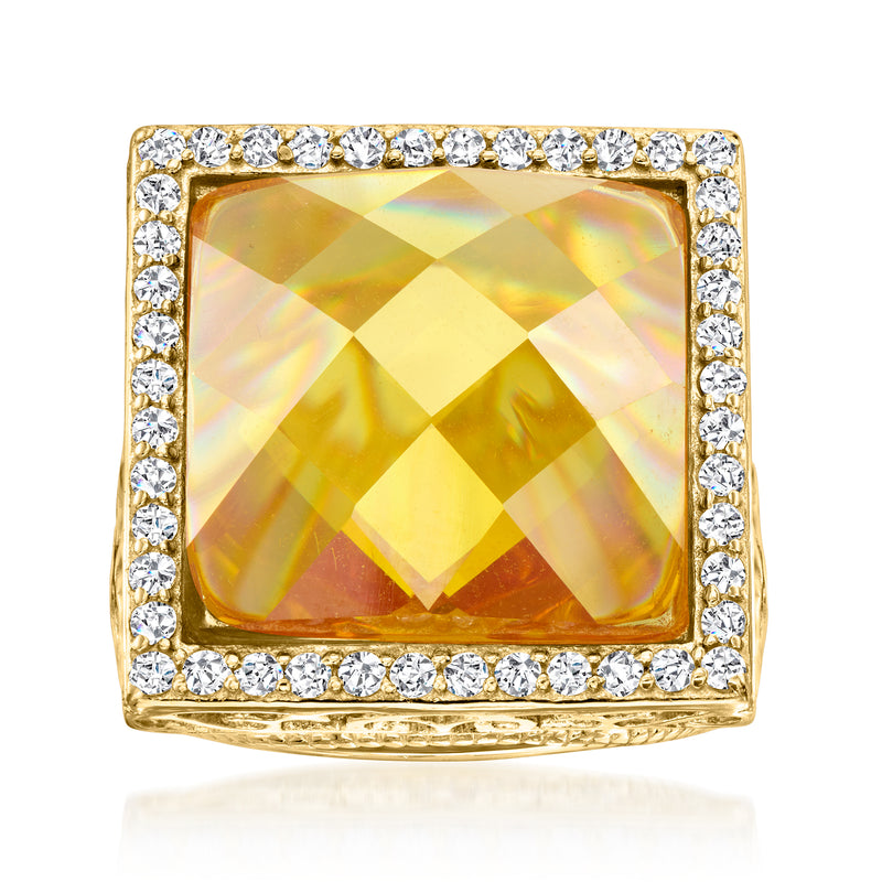 Gold-tone ring with large square yellow stone and clear rhinestone halo