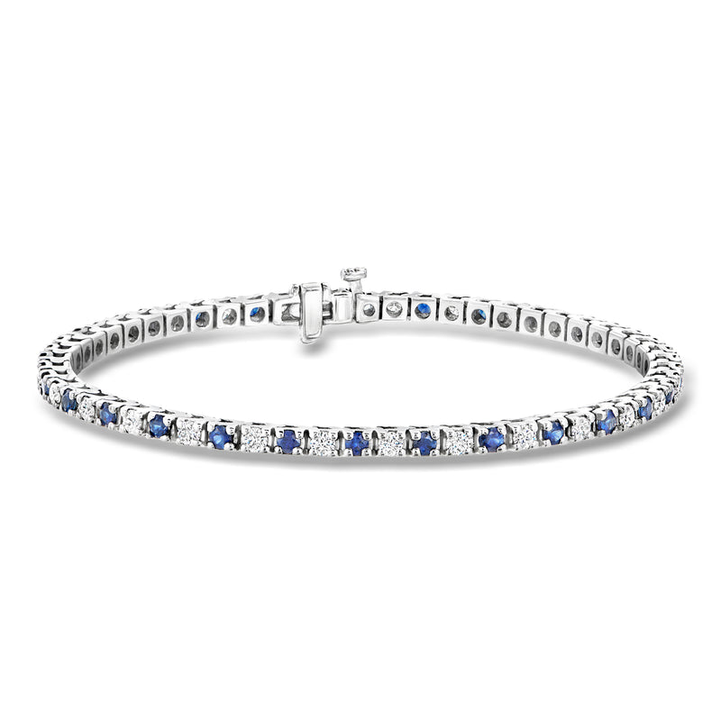 Sapphire and diamond tennis bracelet in white gold, blue stones in metal prongs