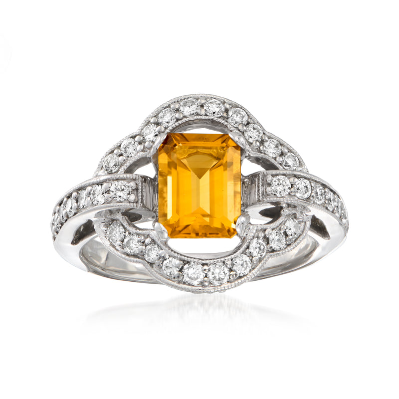 Vintage white gold ring with emerald-cut citrine center and diamond halo